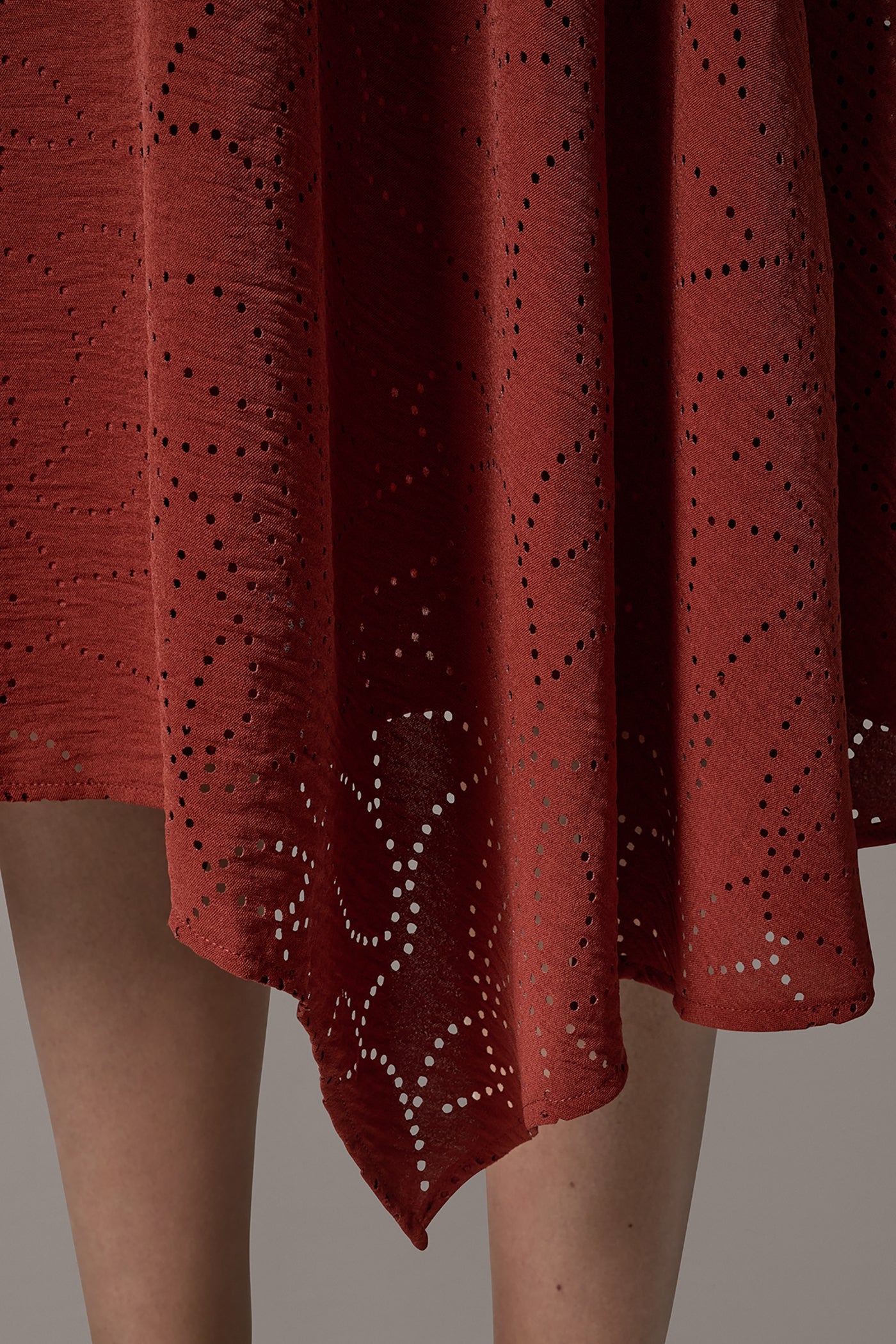 LASER CUT ASYMMETRIC MIDI SKIRT
