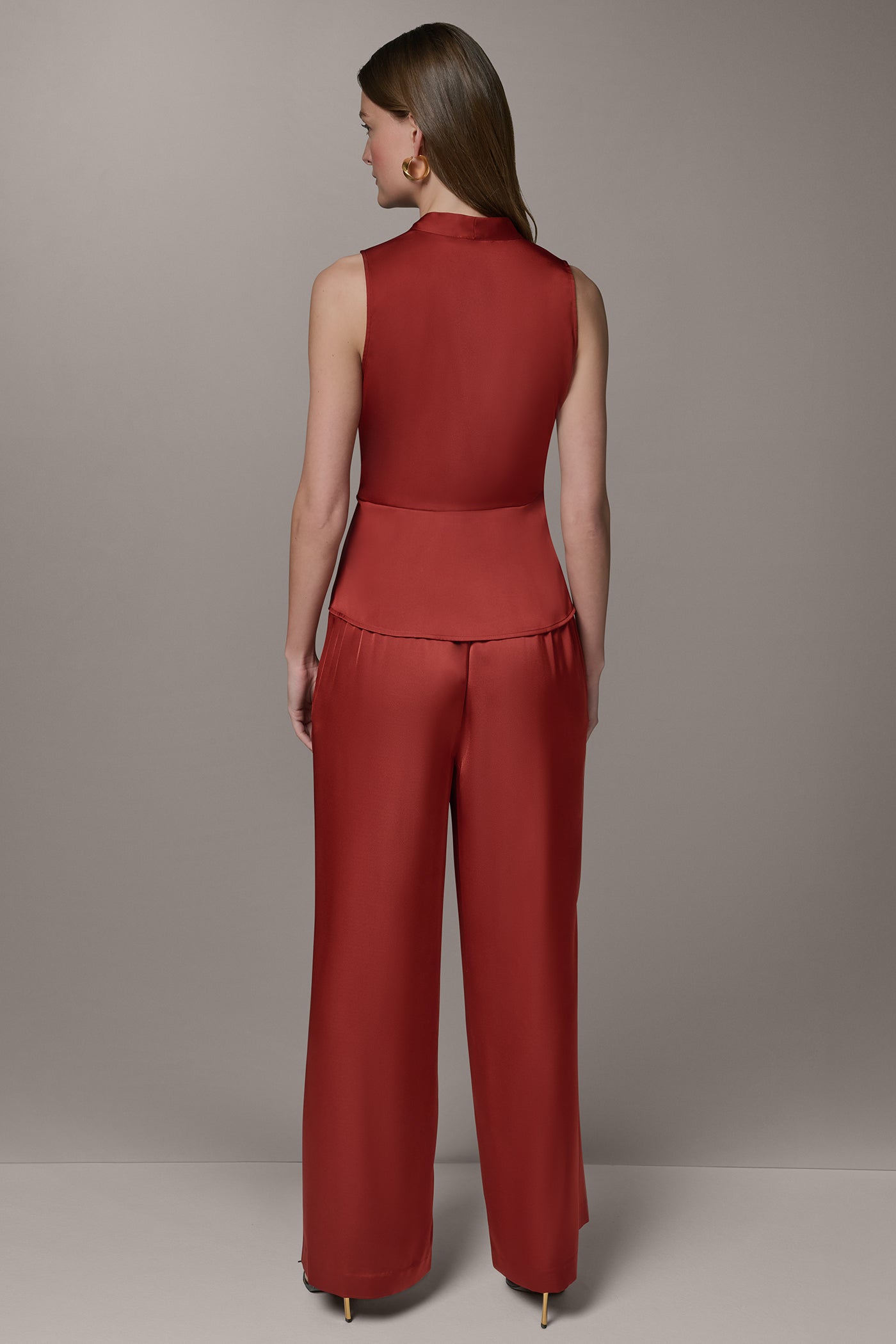 SLEEVELESS WRAP-EFFECT ASYMMETRIC PEPLUM BLOUSE
