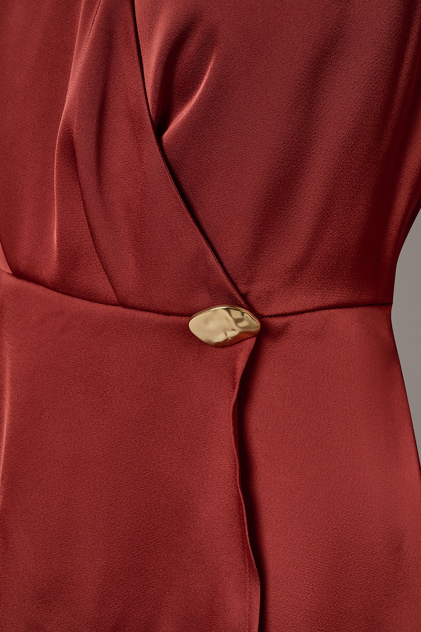 SLEEVELESS WRAP-EFFECT ASYMMETRIC PEPLUM BLOUSE