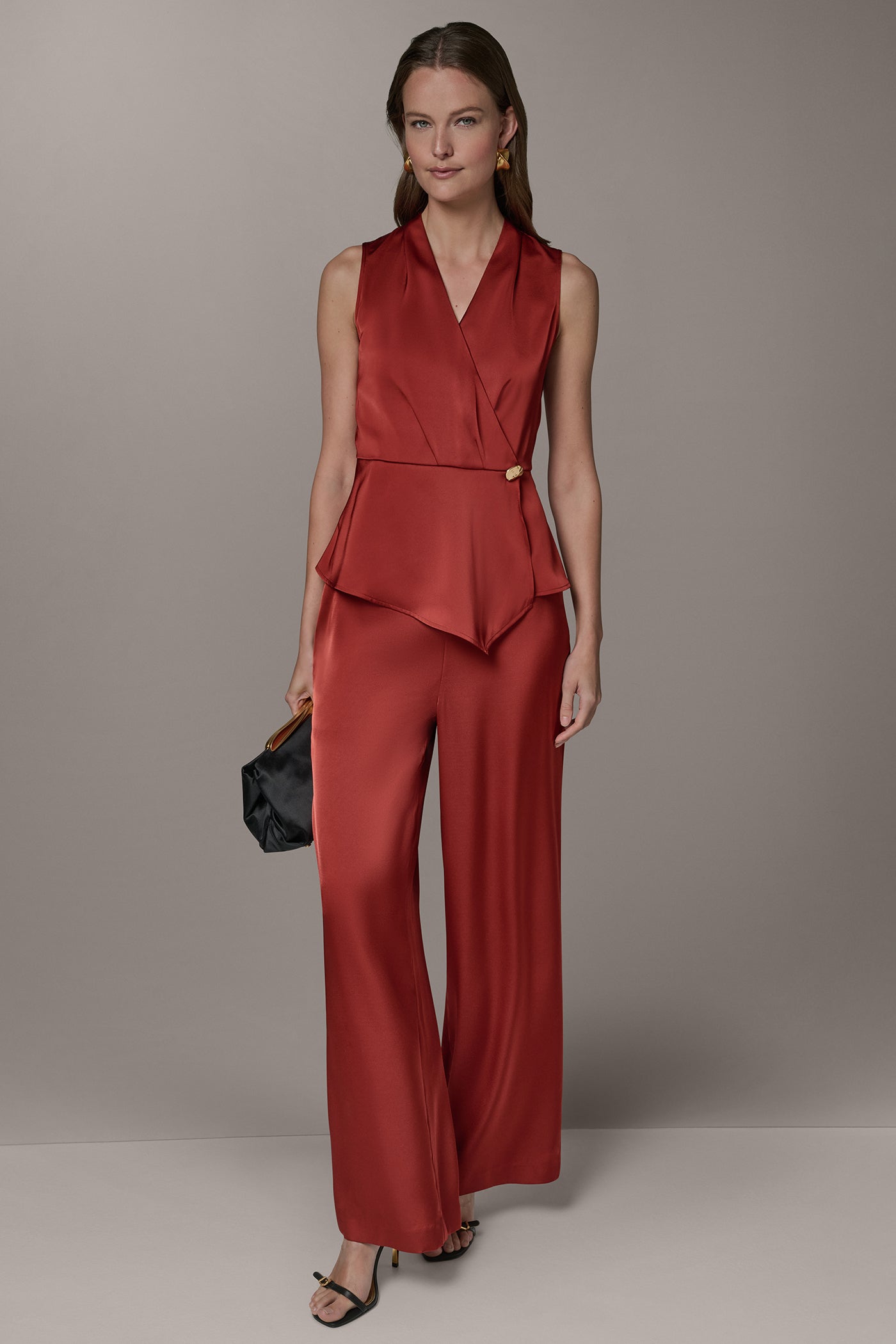 SLEEVELESS WRAP-EFFECT ASYMMETRIC PEPLUM BLOUSE